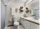 Well-lit bathroom featuring updated fixtures, a shower-tub combination, and ample storage at 1689 Saboff Way, Chuluota, FL 32766