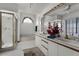 Bright bathroom features a walk-in shower, soaking tub, dual sinks, and vanity lighting at 1689 Saboff Way, Chuluota, FL 32766