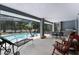 Spacious covered patio with pool access and outdoor dining area at 1689 Saboff Way, Chuluota, FL 32766