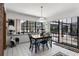 Dining area with a large window view, a sliding glass door, and white tile flooring at 1689 Saboff Way, Chuluota, FL 32766