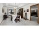 Formal dining room with a chandelier, carpeted floors, and space for a large dining table at 1689 Saboff Way, Chuluota, FL 32766