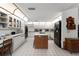 Spacious kitchen with white cabinets, island, and modern appliances at 1689 Saboff Way, Chuluota, FL 32766