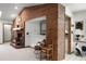 Living room with brick accents and a view into the dining area at 1689 Saboff Way, Chuluota, FL 32766