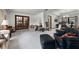 Spacious living room features plush carpeting, natural light, and stylish furniture at 1689 Saboff Way, Chuluota, FL 32766