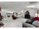 Bright living room with skylights, fan, and view to the kitchen and breakfast nook at 1689 Saboff Way, Chuluota, FL 32766