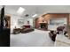 Spacious living room features a brick fireplace, skylights, and a ceiling fan at 1689 Saboff Way, Chuluota, FL 32766