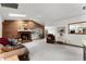 Open living room boasts a brick fireplace and views into the kitchen at 1689 Saboff Way, Chuluota, FL 32766