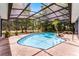 Screened-in pool with clear water, patio, and mature landscaping surrounding the enclosure at 1689 Saboff Way, Chuluota, FL 32766