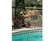 A view of the pool area and backyard, with a mother deer and fawn at 1689 Saboff Way, Chuluota, FL 32766