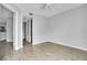 Light-filled bedroom with hardwood floors and access to the en-suite bathroom and kitchen at 1908 Lake Atriums Cir # 3, Orlando, FL 32839