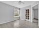 Bedroom with light hardwood floors, ceiling fan, window, and glass door to the patio at 1908 Lake Atriums Cir # 3, Orlando, FL 32839