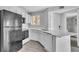Bright kitchen featuring white cabinets, updated appliances, and a stylish countertop at 1908 Lake Atriums Cir # 3, Orlando, FL 32839