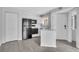 Modern kitchen with white cabinets, black appliances, and sleek gray flooring at 1908 Lake Atriums Cir # 3, Orlando, FL 32839