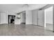 Open-concept living space with modern flooring, updated kitchen, and access to multiple rooms at 1908 Lake Atriums Cir # 3, Orlando, FL 32839