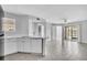 Bright, open-concept living area featuring modern flooring, a ceiling fan, and sliding doors to a patio at 1908 Lake Atriums Cir # 3, Orlando, FL 32839