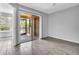 Bright room with hardwood floors, sliding doors to the screened porch, and an open doorway to a nearby room at 1908 Lake Atriums Cir # 3, Orlando, FL 32839