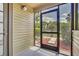 View of a screened-in patio featuring a garden view, enhancing outdoor living and privacy at 1908 Lake Atriums Cir # 3, Orlando, FL 32839