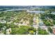 An aerial view showcases a city skyline and waterfront surrounded by lush greenery and houses, offering a tranquil setting at 2114 Gerda Ter, Orlando, FL 32804