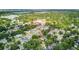 Charming neighborhood with lush greenery and various architectural styles, conveniently located near a school and lake at 2114 Gerda Ter, Orlando, FL 32804