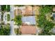 An aerial view of this residential neighborhood featuring mature trees surrounding a single-Gathering house at 2114 Gerda Ter, Orlando, FL 32804