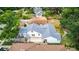 Aerial view of a white home with gray roof, showing landscaping and backyard space at 2114 Gerda Ter, Orlando, FL 32804