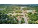 Expansive aerial view of the neighborhood featuring lush greenery, roads, and residential homes at 2114 Gerda Ter, Orlando, FL 32804