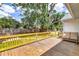Spacious wooden deck perfect for outdoor entertaining with a view of the lush backyard at 2114 Gerda Ter, Orlando, FL 32804