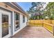Well-maintained backyard deck with access to the yard, great for summer barbecues at 2114 Gerda Ter, Orlando, FL 32804