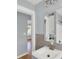 Bathroom sink and mirror with views to adjoining rooms at 2114 Gerda Ter, Orlando, FL 32804
