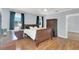 Bedroom featuring hardwood floors, a ceiling fan, and bright windows with dark curtains at 2114 Gerda Ter, Orlando, FL 32804