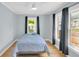 Bright bedroom featuring multiple windows and ceiling fan at 2114 Gerda Ter, Orlando, FL 32804