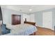 Bedroom featuring hardwood floors, a ceiling fan, and an ensuite bathroom at 2114 Gerda Ter, Orlando, FL 32804