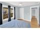 Bedroom with hardwood floors, multiple windows, and ensuite at 2114 Gerda Ter, Orlando, FL 32804