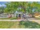 Captivating house with a green lawn and mature trees, offering shade and charm in a peaceful neighborhood at 2114 Gerda Ter, Orlando, FL 32804