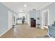 Open concept living room with tile floors, a ceiling fan and open access to the kitchen at 2114 Gerda Ter, Orlando, FL 32804