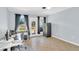 Bright home office with tile flooring, desk, safe, and access to the backyard at 2114 Gerda Ter, Orlando, FL 32804