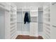 Walk-in closet featuring built-in shelving, drawers, and rods for maximum storage at 2114 Gerda Ter, Orlando, FL 32804