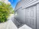 View of the side of the house shows access to a large, cleared backyard area at 2121 Vivada St, Orlando, FL 32803