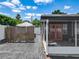 View of the backyard featuring a screened patio and partial fence at 2121 Vivada St, Orlando, FL 32803