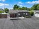 Aerial view of the spacious backyard, featuring a screened patio and ample space for gardening at 2121 Vivada St, Orlando, FL 32803