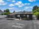Large backyard with a cozy screened patio, ideal for gardening or entertaining guests outdoors at 2121 Vivada St, Orlando, FL 32803