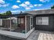 Charming screened patio with access to a well-maintained yard, perfect for outdoor relaxation and entertaining at 2121 Vivada St, Orlando, FL 32803