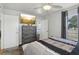 Bedroom featuring gray furnishings, a ceiling fan, and a large window at 2314 Falkner Rd, Orlando, FL 32810