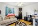 Bonus room featuring hardwood floors, seating, and a dart board at 2314 Falkner Rd, Orlando, FL 32810