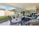 Spacious covered patio with comfortable wicker seating, perfect for outdoor relaxation and entertaining at 2314 Falkner Rd, Orlando, FL 32810