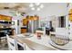 Open-concept dining area with seamless flow to the kitchen and a view of the living room at 2314 Falkner Rd, Orlando, FL 32810