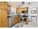 Functional kitchen with stainless steel appliances, oak cabinets, and ample counter space at 2314 Falkner Rd, Orlando, FL 32810
