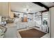 Large laundry room with ample counter space, storage cabinets, and convenient access to the outdoors at 2314 Falkner Rd, Orlando, FL 32810