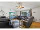 Spacious living room with hardwood floors, ceiling fan, and comfortable seating, perfect for relaxation at 2314 Falkner Rd, Orlando, FL 32810