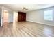 Bright primary bedroom with luxury vinyl plank flooring and large closet at 2648 Needlepoint St, Kissimmee, FL 34741